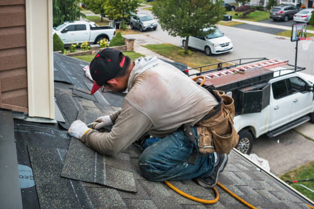 Professional Roofing technician working in Howard, PA